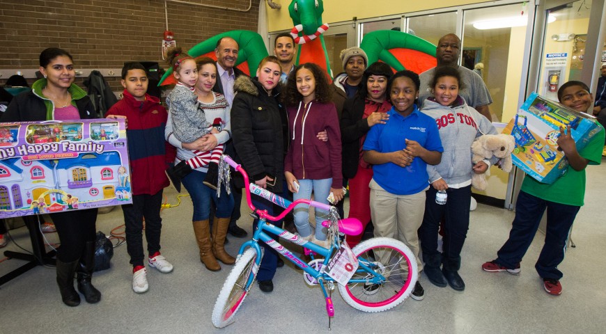 Cruz Companies Hosts Holiday Gift Giving Celebration for Young Residents in Roxbury